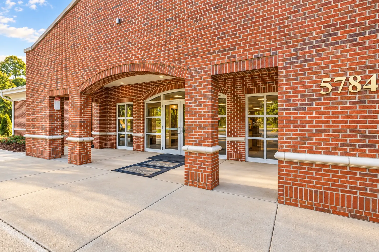 Brick entrance and 5784 address numerals at Cadenhead Legacy Center